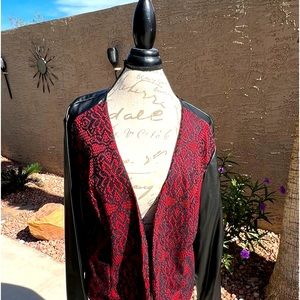Beautiful red and black faux leather jacket with lace details.